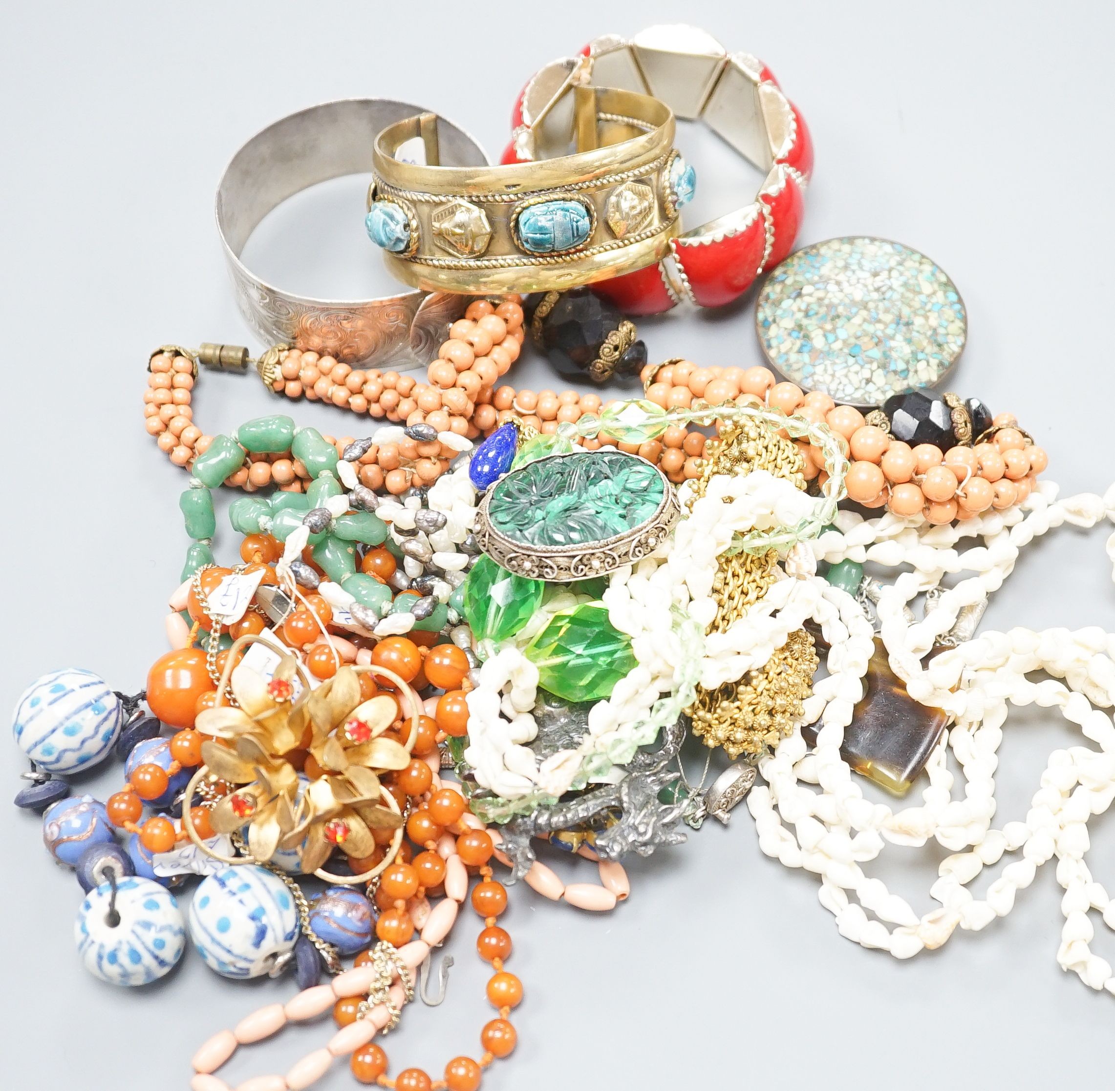 A gilt metal bangle and ring and mixed costume jewellery.